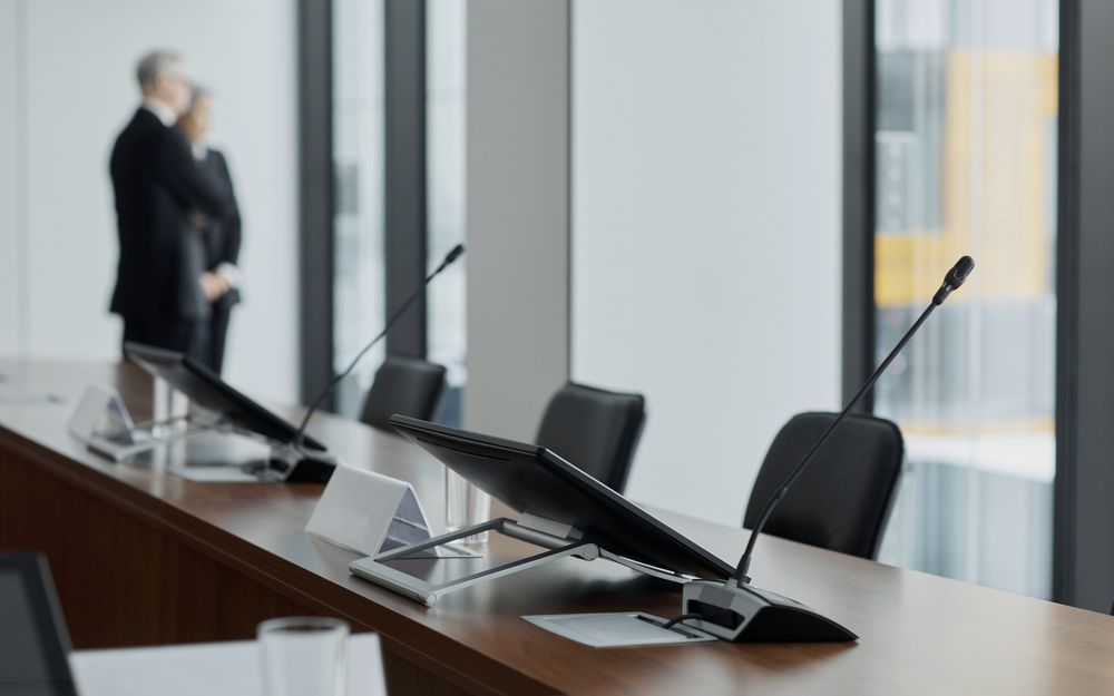A modern boardroom set for a formal meeting