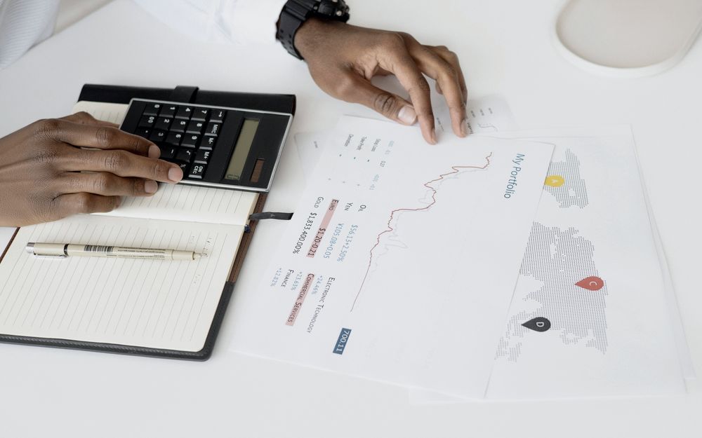 Working through financial reports with a calculator